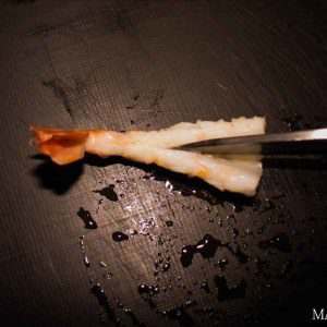 cutting-shrimp-to-make-shrimp-sushi