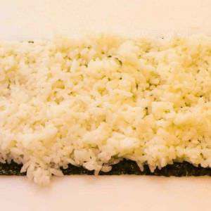 half-a-sheet-of-nori-with-cooked-sushi-rice-on-top
