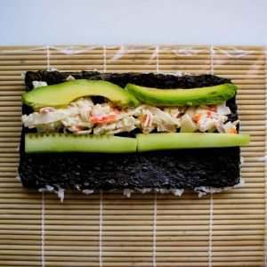 california-roll-layed-out-on-sushi-rolling-mat