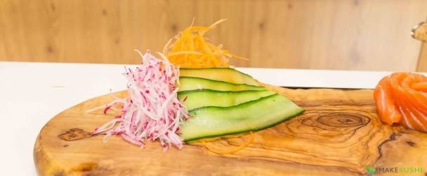 garnishing a sashimi plate
